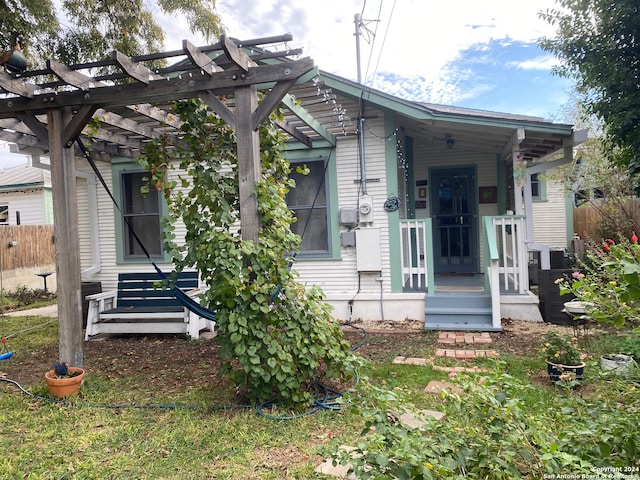 view of front of property with a pergola