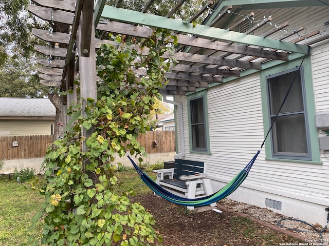 view of property exterior with a pergola