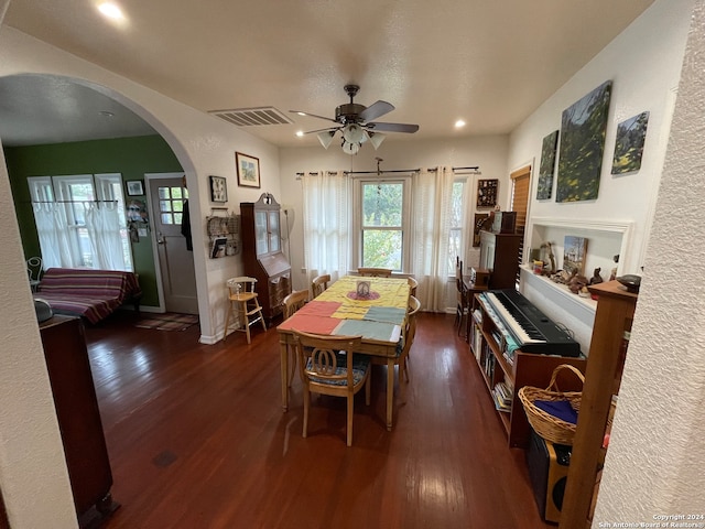 dining space with ceiling fan and dark hardwood / wood-style floors