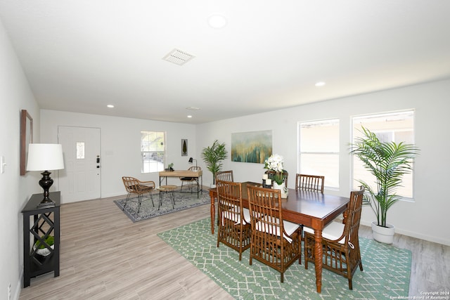 dining area with light hardwood / wood-style floors