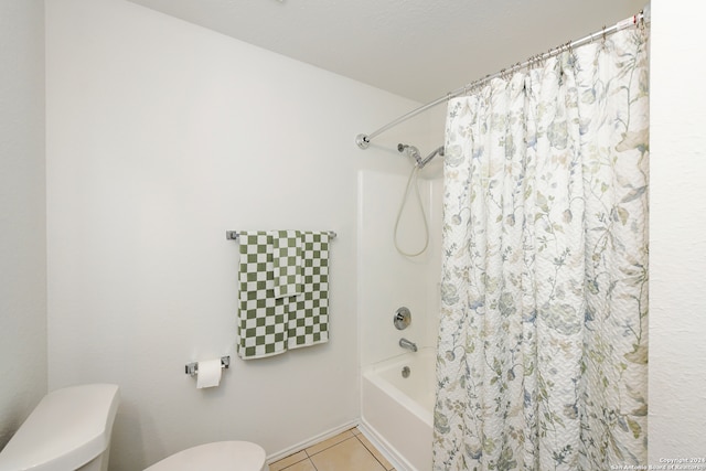 bathroom with tile patterned flooring, shower / bathtub combination with curtain, and toilet