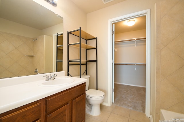 full bathroom with tile patterned flooring, vanity, toilet, and tiled shower / bath