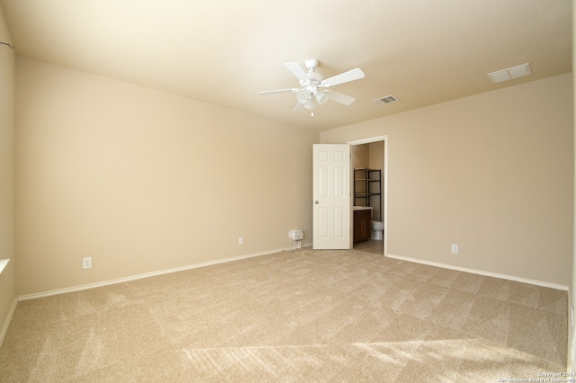 carpeted empty room with ceiling fan