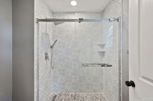 bathroom featuring an enclosed shower