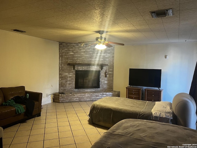 6118 Elm Valley Dr, San Antonio, TX 78242 - living area featuring light tile patterned floors, ceiling fan, and a brick fireplace
