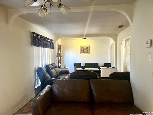 6118 Elm Valley Dr, San Antonio, TX 78242 - living area with arched walkways, a ceiling fan, and baseboards