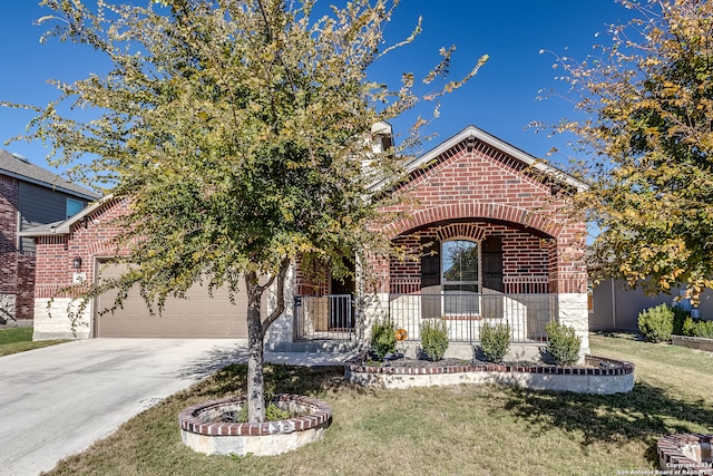 view of front of property featuring a garage and a front lawn