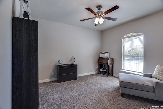 living area featuring ceiling fan and carpet floors