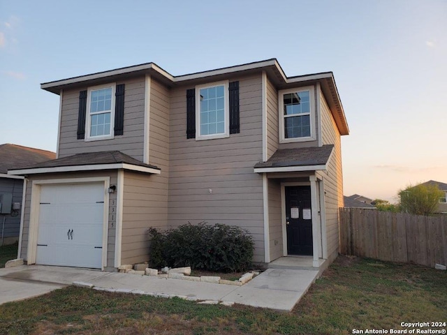 front of property with a garage