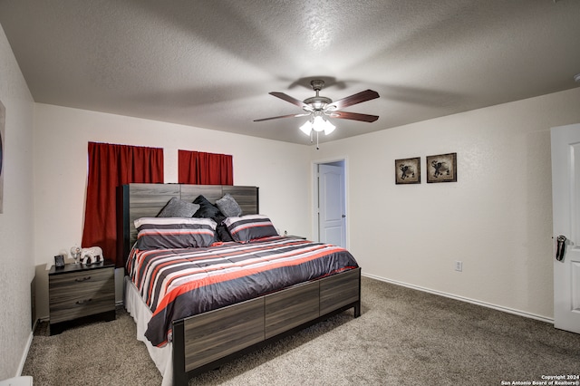 bedroom with carpet flooring, a textured ceiling, and ceiling fan