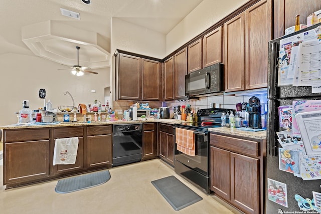 kitchen with kitchen peninsula, backsplash, ceiling fan, and black appliances