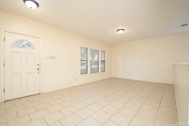 tiled foyer entrance featuring a wealth of natural light