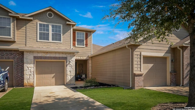 view of front of home with a front lawn and a garage