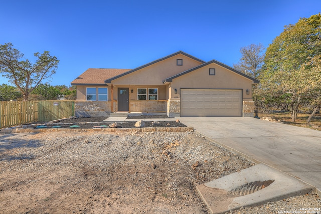 ranch-style home featuring a garage