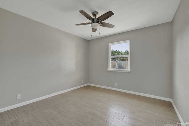 unfurnished room featuring ceiling fan and light hardwood / wood-style floors