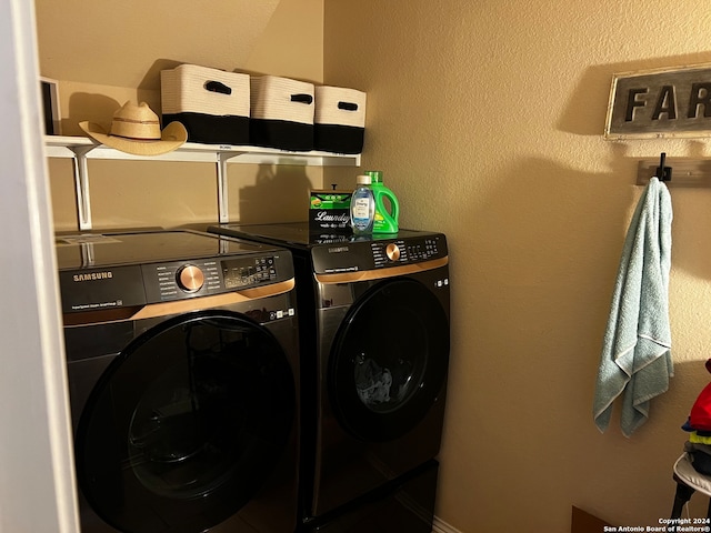 clothes washing area featuring separate washer and dryer