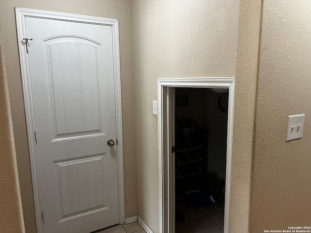 interior space with light tile patterned floors