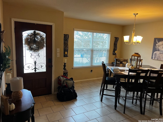 dining space with a chandelier