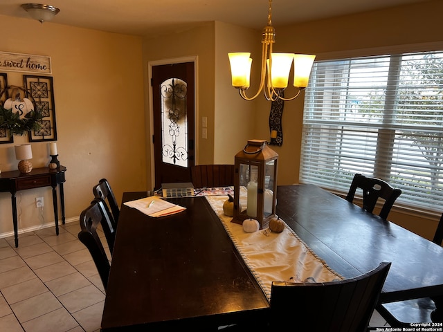 dining room featuring light tile patterned floors and a chandelier