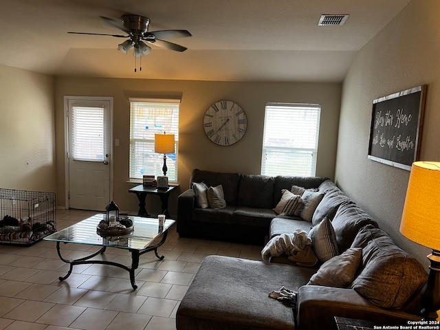 living room with ceiling fan and lofted ceiling