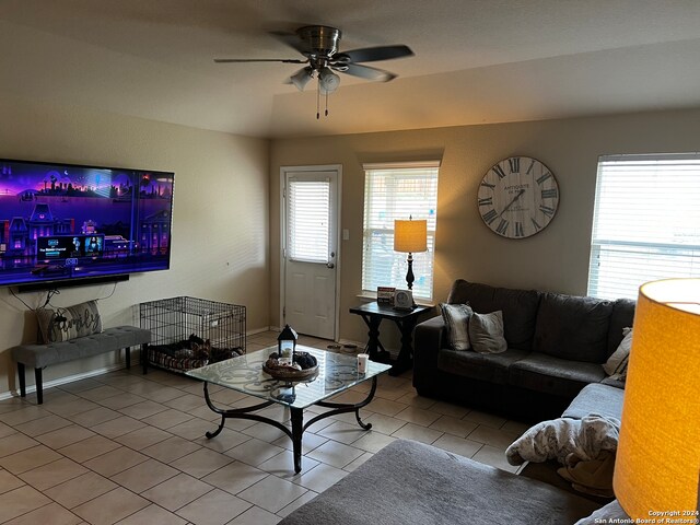 tiled living room featuring ceiling fan