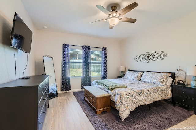 bedroom with hardwood / wood-style flooring and ceiling fan