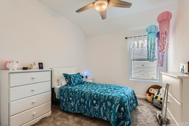 carpeted bedroom featuring ceiling fan and lofted ceiling