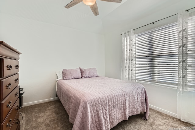 bedroom featuring dark colored carpet and ceiling fan