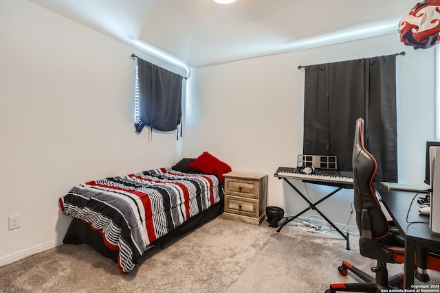 bedroom with light colored carpet