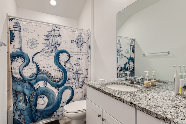 bathroom with a shower with curtain, vanity, and toilet