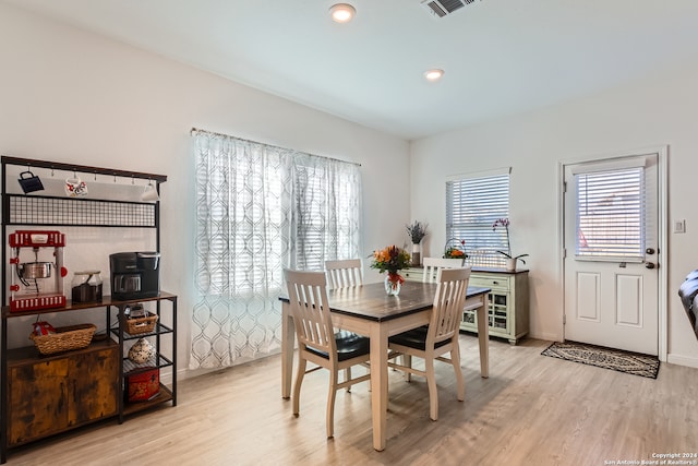 dining space featuring light wood-type flooring