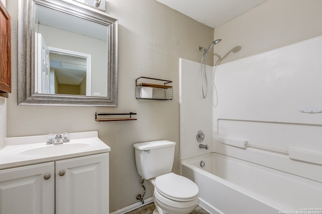 full bathroom with vanity, toilet, washtub / shower combination, and a textured ceiling