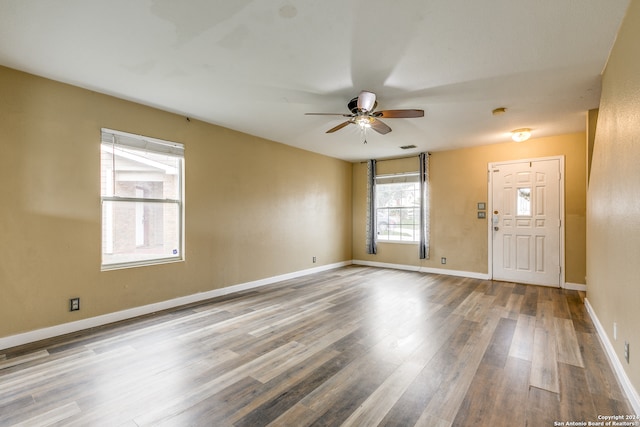 spare room featuring ceiling fan and wood-type flooring