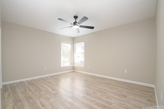 spare room featuring ceiling fan and light hardwood / wood-style floors