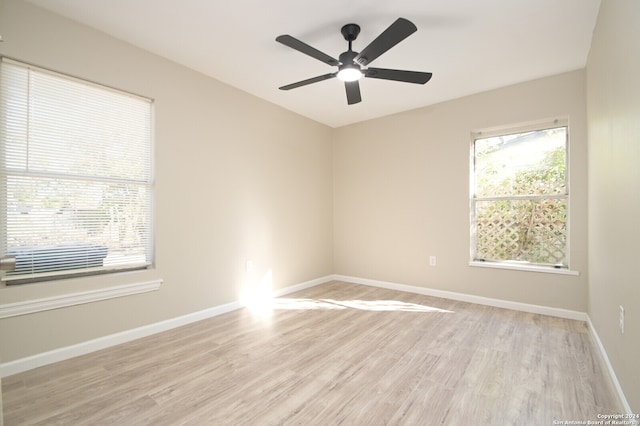 spare room featuring ceiling fan and light hardwood / wood-style flooring