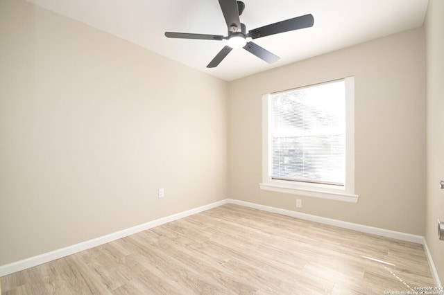 empty room featuring ceiling fan and light hardwood / wood-style flooring