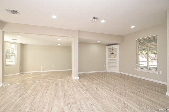 basement featuring light wood-type flooring