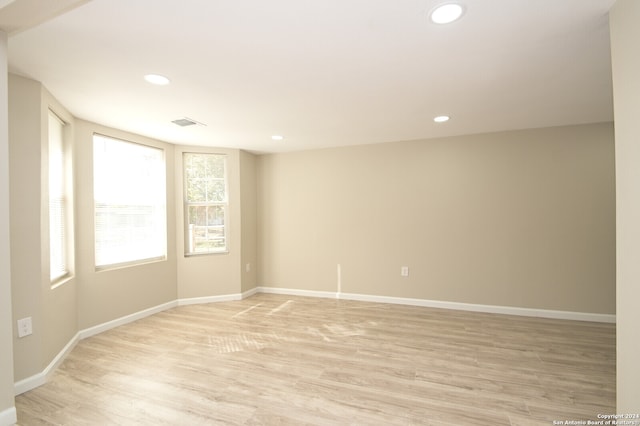 spare room featuring light hardwood / wood-style floors