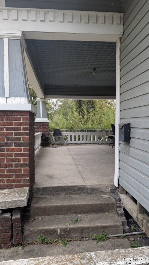 view of patio featuring covered porch