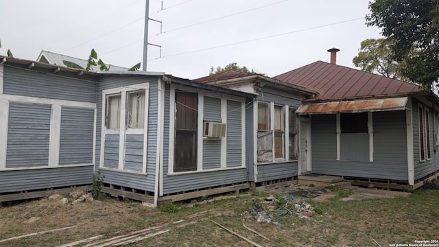 view of side of property with cooling unit