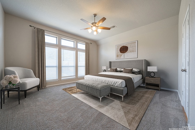 carpeted bedroom with lofted ceiling and ceiling fan