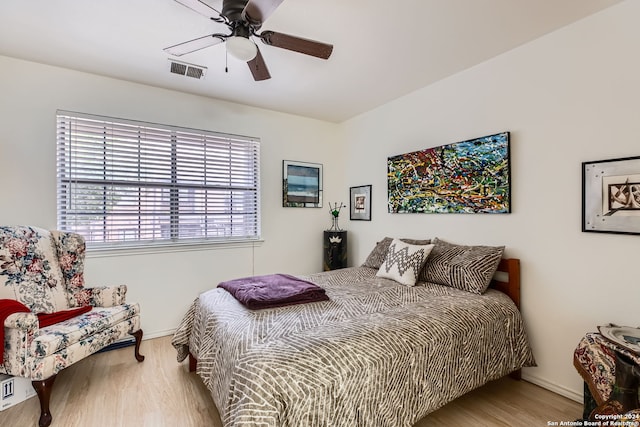 bedroom featuring light wood-type flooring and ceiling fan