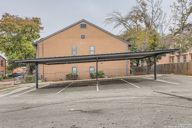 view of vehicle parking with a carport