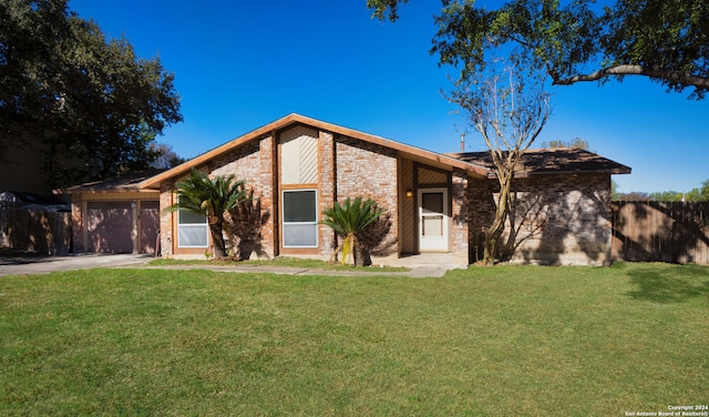 ranch-style house with a garage and a front lawn