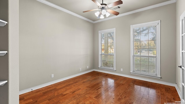 empty room with hardwood / wood-style floors, ceiling fan, and crown molding