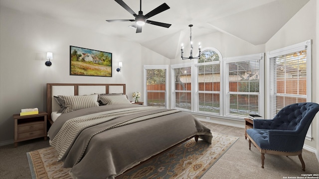 bedroom featuring carpet floors, ceiling fan with notable chandelier, and lofted ceiling