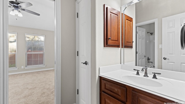 bathroom with ceiling fan and vanity