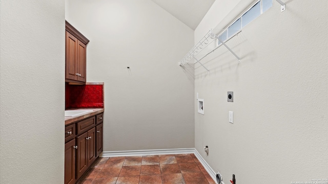 washroom with cabinets, washer hookup, gas dryer hookup, and electric dryer hookup