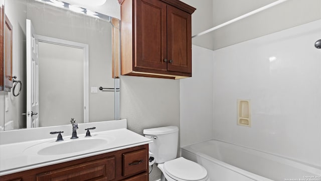 full bathroom with vanity,  shower combination, and toilet