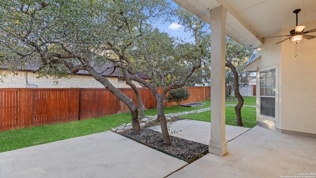 view of patio featuring ceiling fan